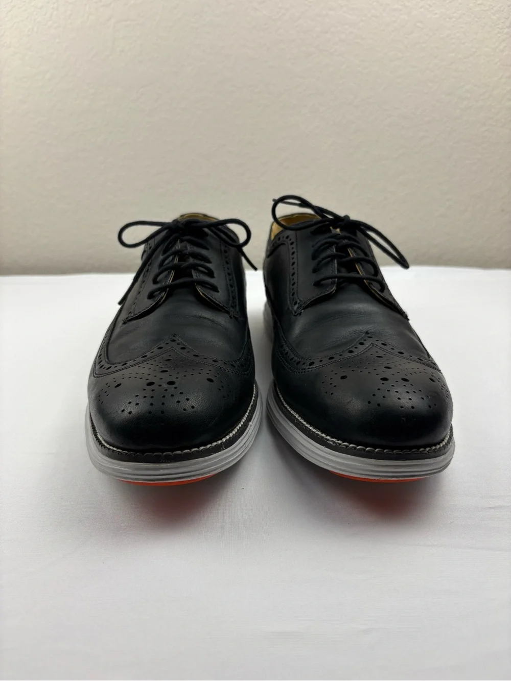 Cole Haan Original Grand wingtip Oxford shoes in black leather.